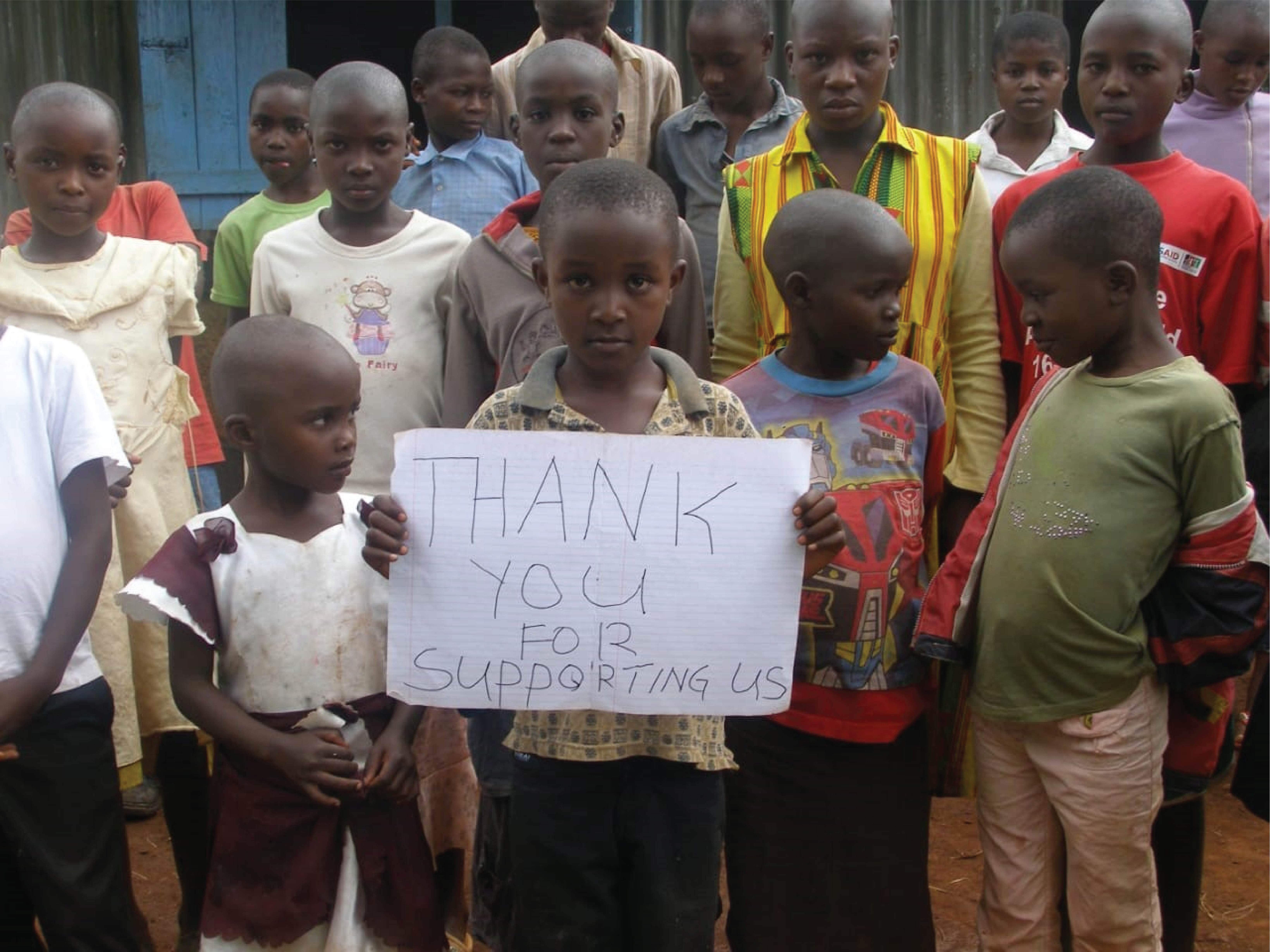 A group of children holding a thank you sign-01