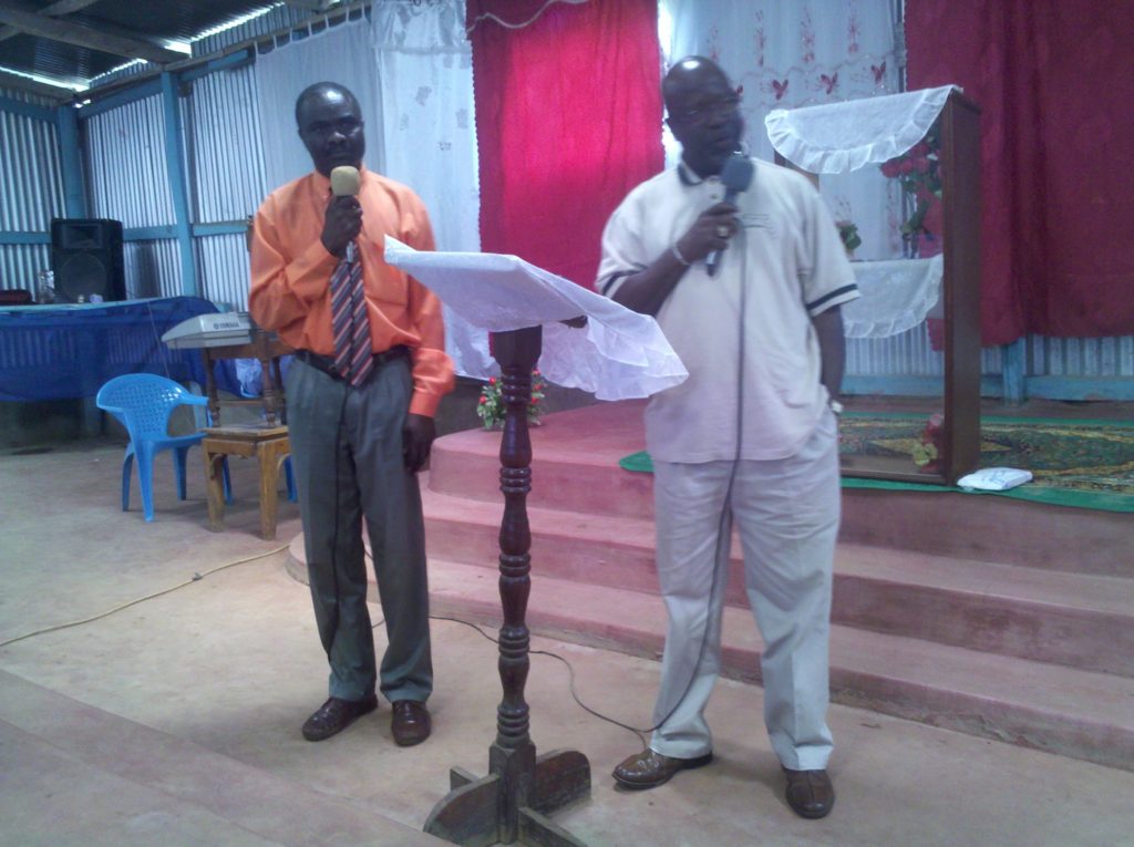 Two members of Beacon Light Ministries International having a speech